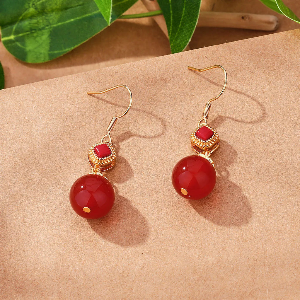 Southern Red Agate round bead earrings with S925 silver inlaid jasper detail in geometric copper alloy design