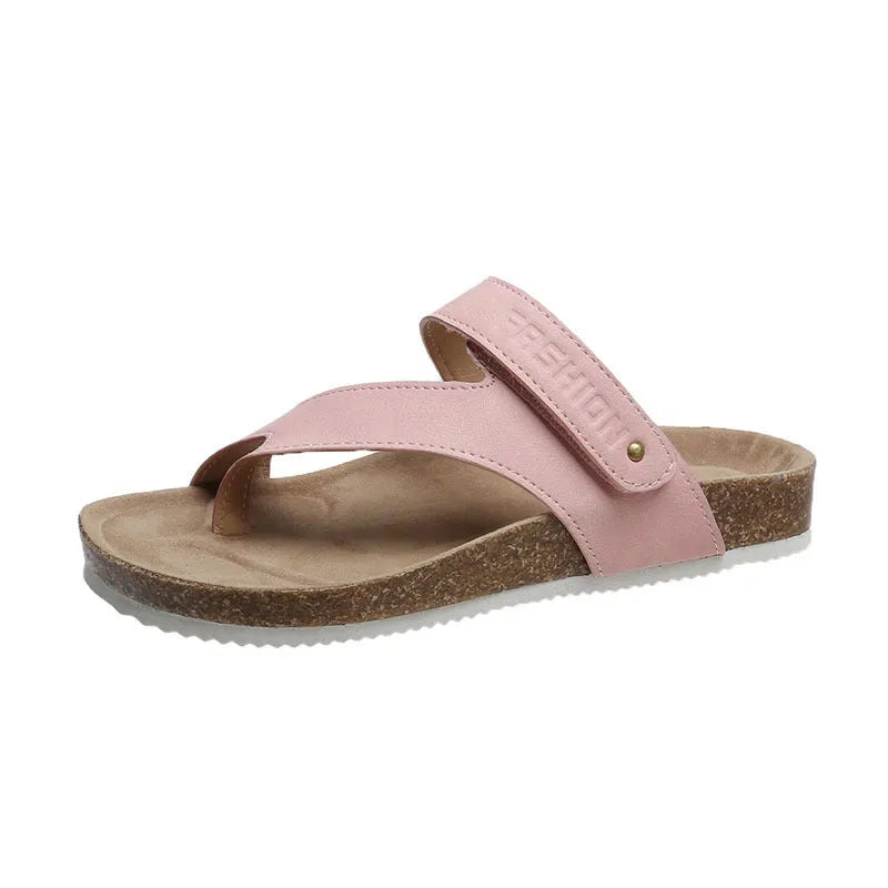 A pair of solid-colour flip-flops with a flat toe ring and thick foam sole.