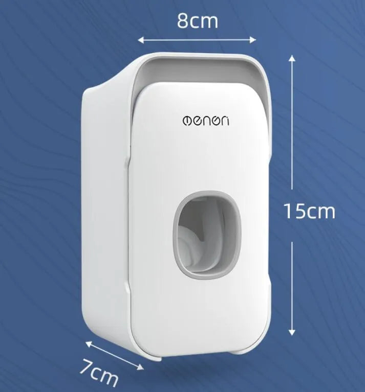Wall-mounted automatic toothpaste dispenser in blue, grey, or pink colours with a visible dispensing lever.