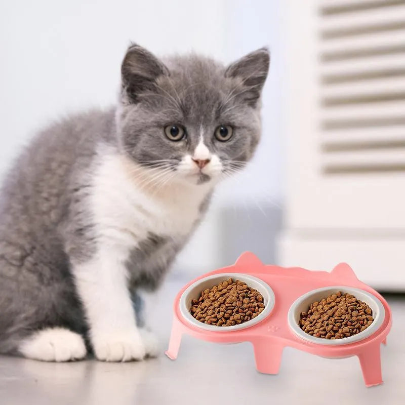 Ceramic cat bowl set with elevated tilted feeding stand in blue, pink, white, and yellow colour options