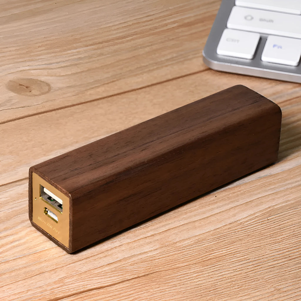 Solid walnut wood portable power bank with 2000mAh battery showing dimensions of 100mm x 25mm x 25mm