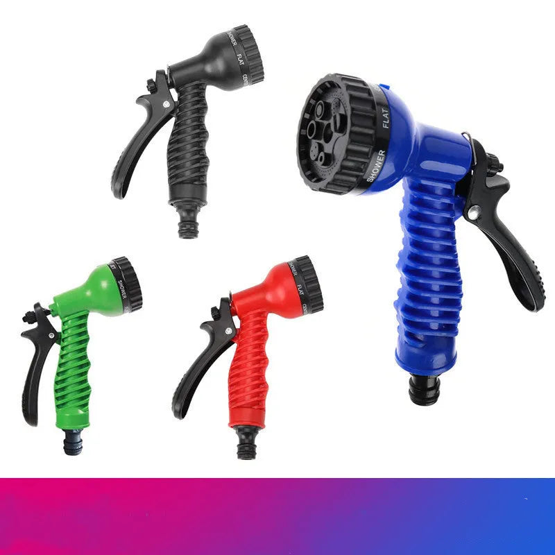 Garden telescopic hose sprinkler with ABS gun head extended on a lawn