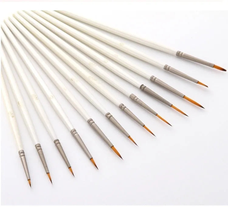 Set of 12 Pearl White artist paint brushes with nylon wool bristles, metal ferrules, and wooden handles.
