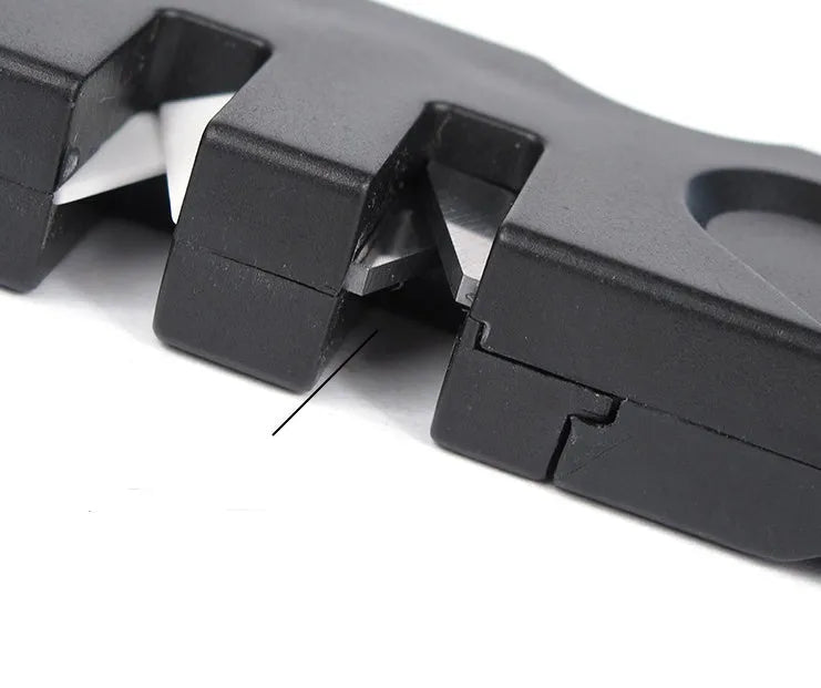 Pocket Pal knife sharpener in black with diamond rod, carbide blades, and ceramic stones open for use