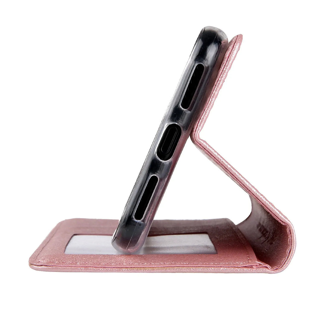 Black PU leather flip phone case for Apple iPhone with card slots open.