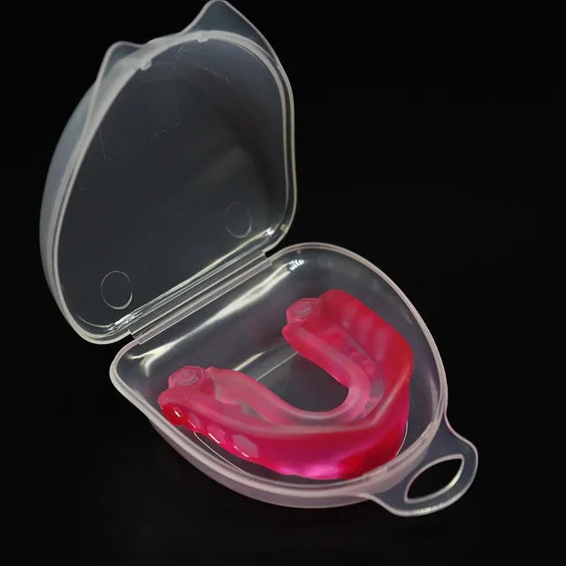 Silicone mouth guard in pink with transparent lockable storage box
