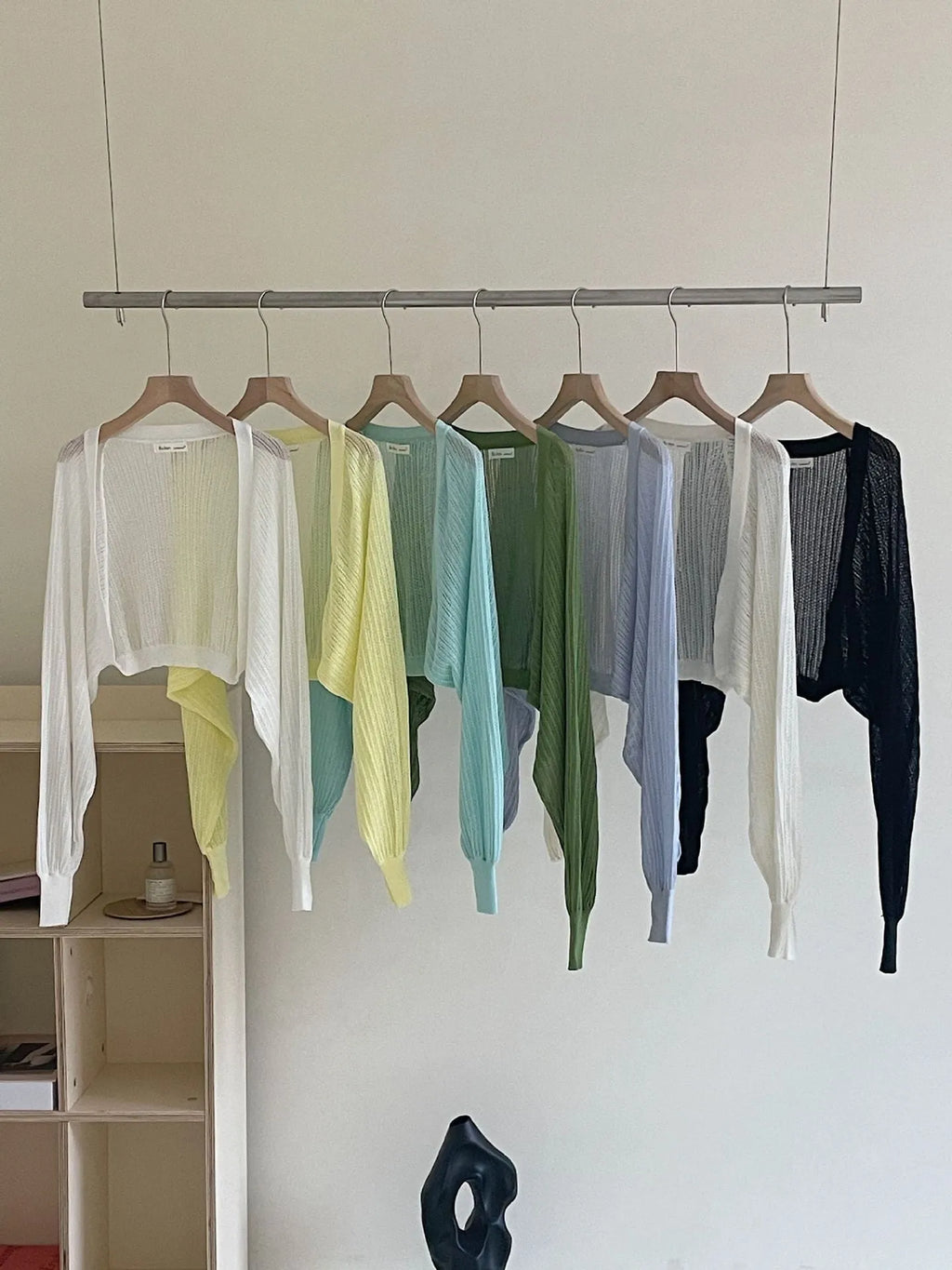 Women's apricot coloured blouse with long loose lantern sleeves and a hollow linen-look weave.