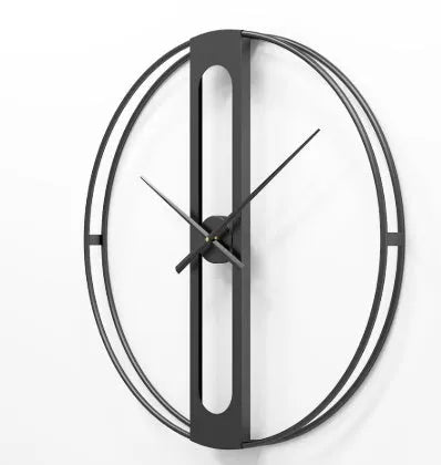 Large round metal wall clock with black dial and gold Arabic numerals on a white wall