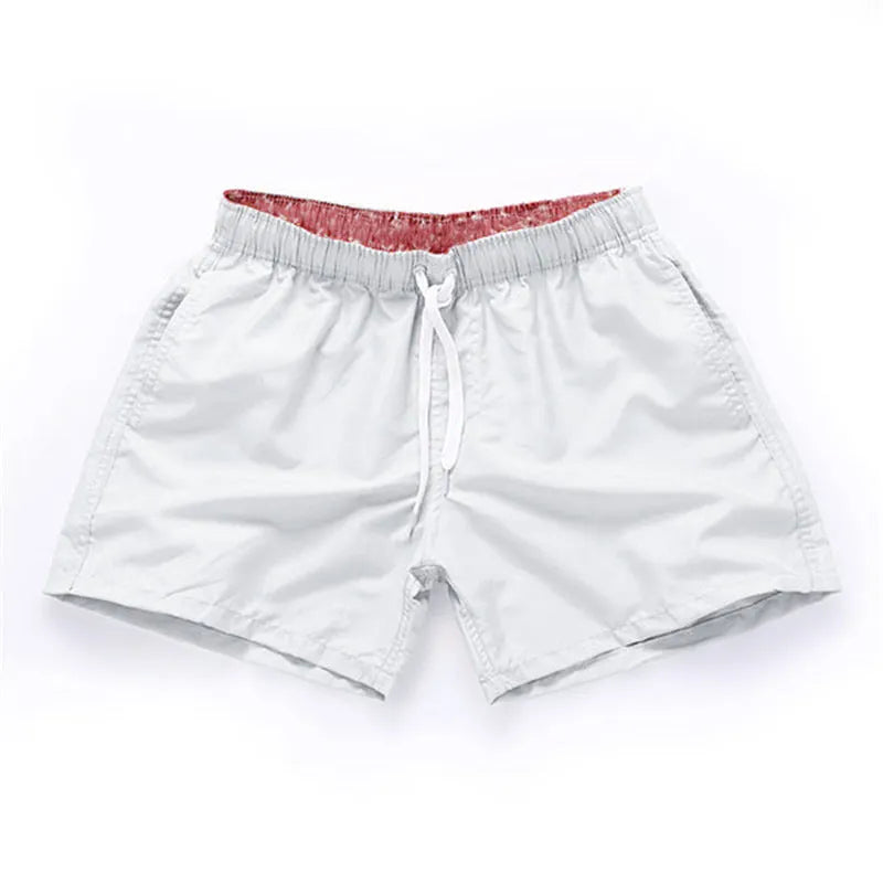Men's straight leg beach shorts in polyester available in multiple colours and plus sizes.