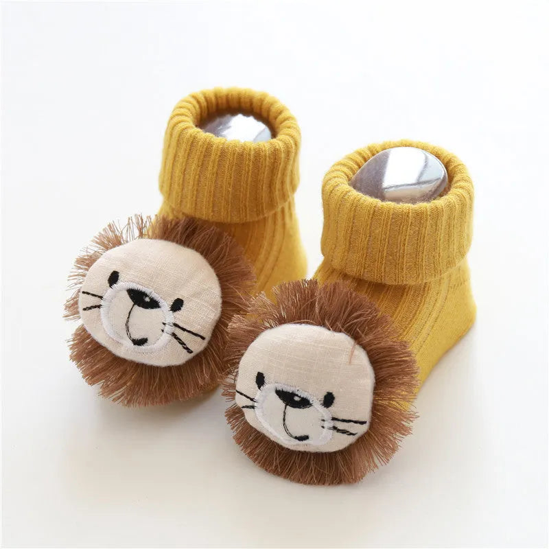 Cotton baby floor socks in assorted colours and patterns including bows, stars, and animal designs.