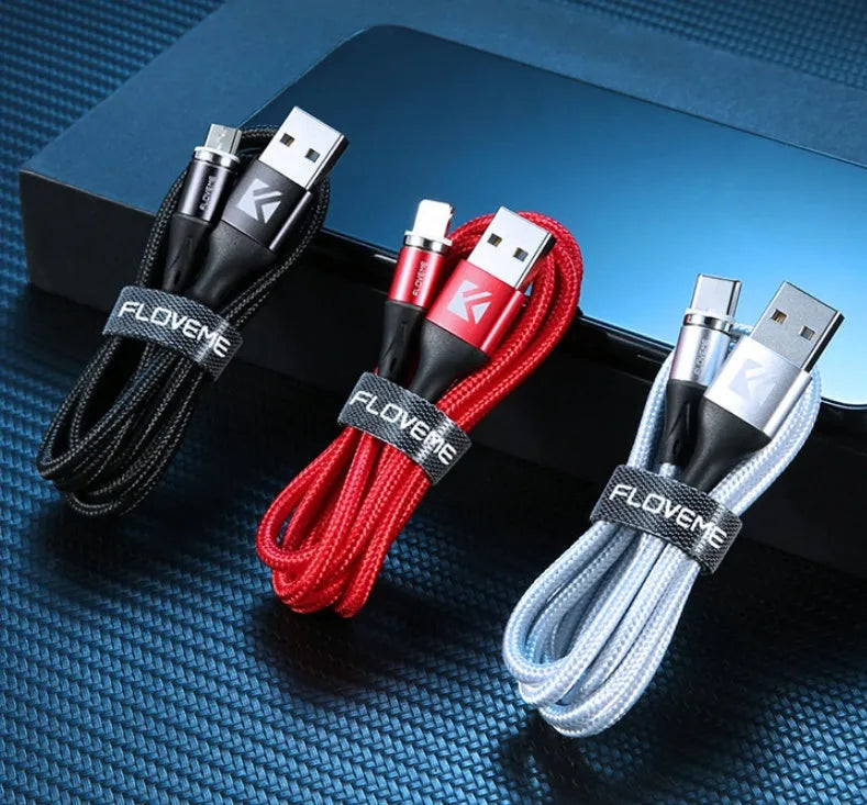 Black magnetic data cable with LED light on connector next to smartphone