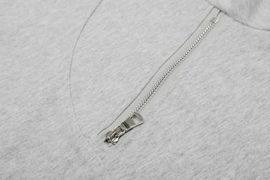 A man's loose-fit cotton pullover hoodie in a simple retro style, shown in grey colour.