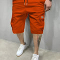 Men's polyester straight-leg shorts in black showing side pocket and waistband detail