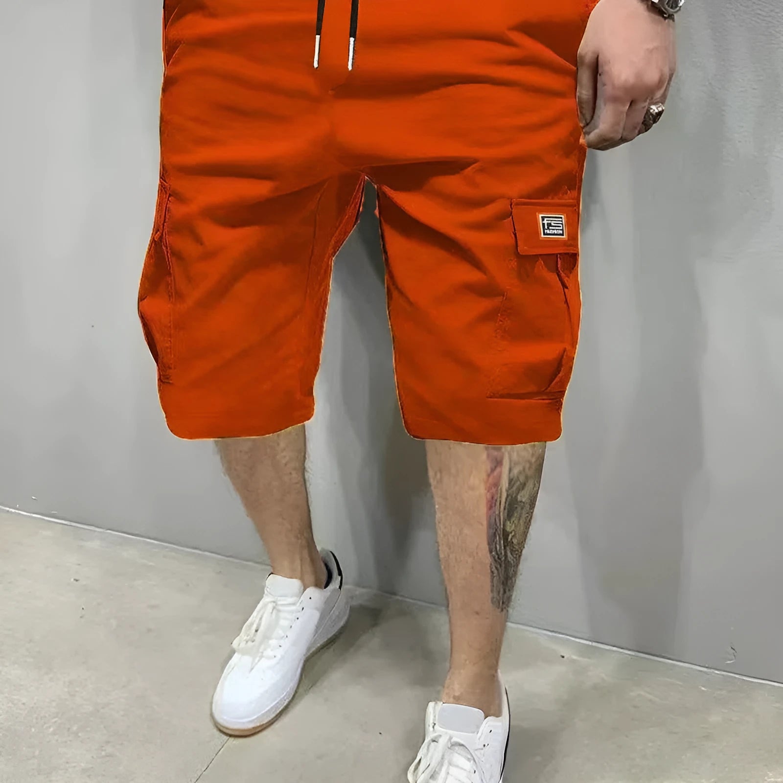 Men's polyester straight-leg shorts in black showing side pocket and waistband detail