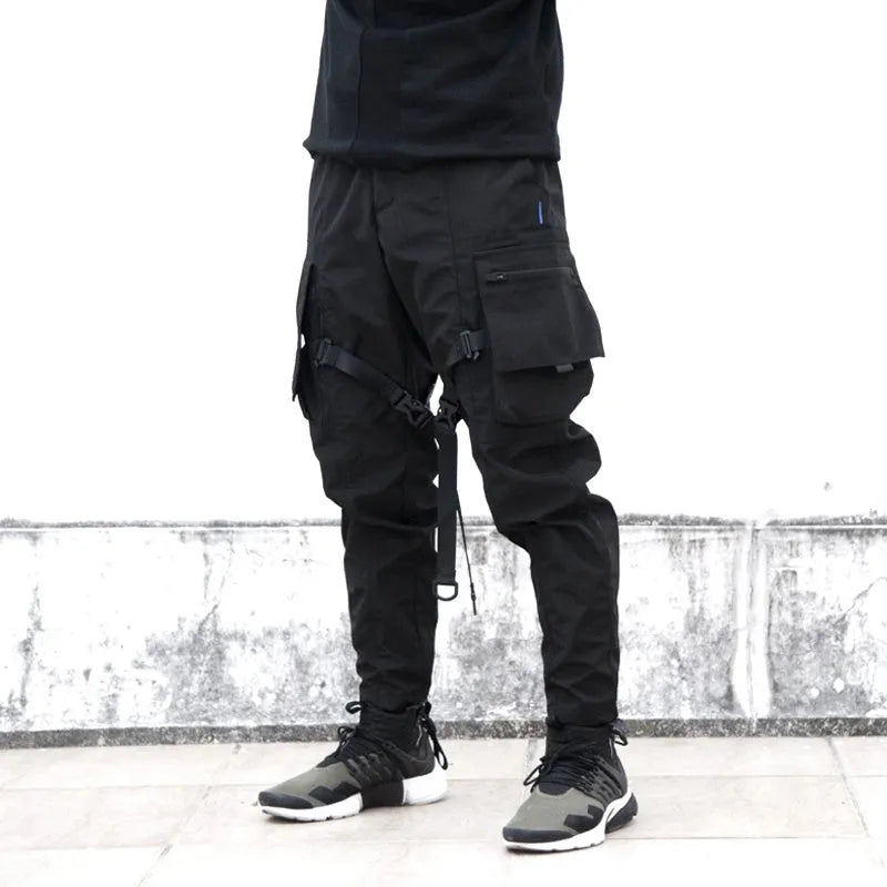 Black waterproof paratrooper trousers with integrated pant straps and 100% polyester fibre construction