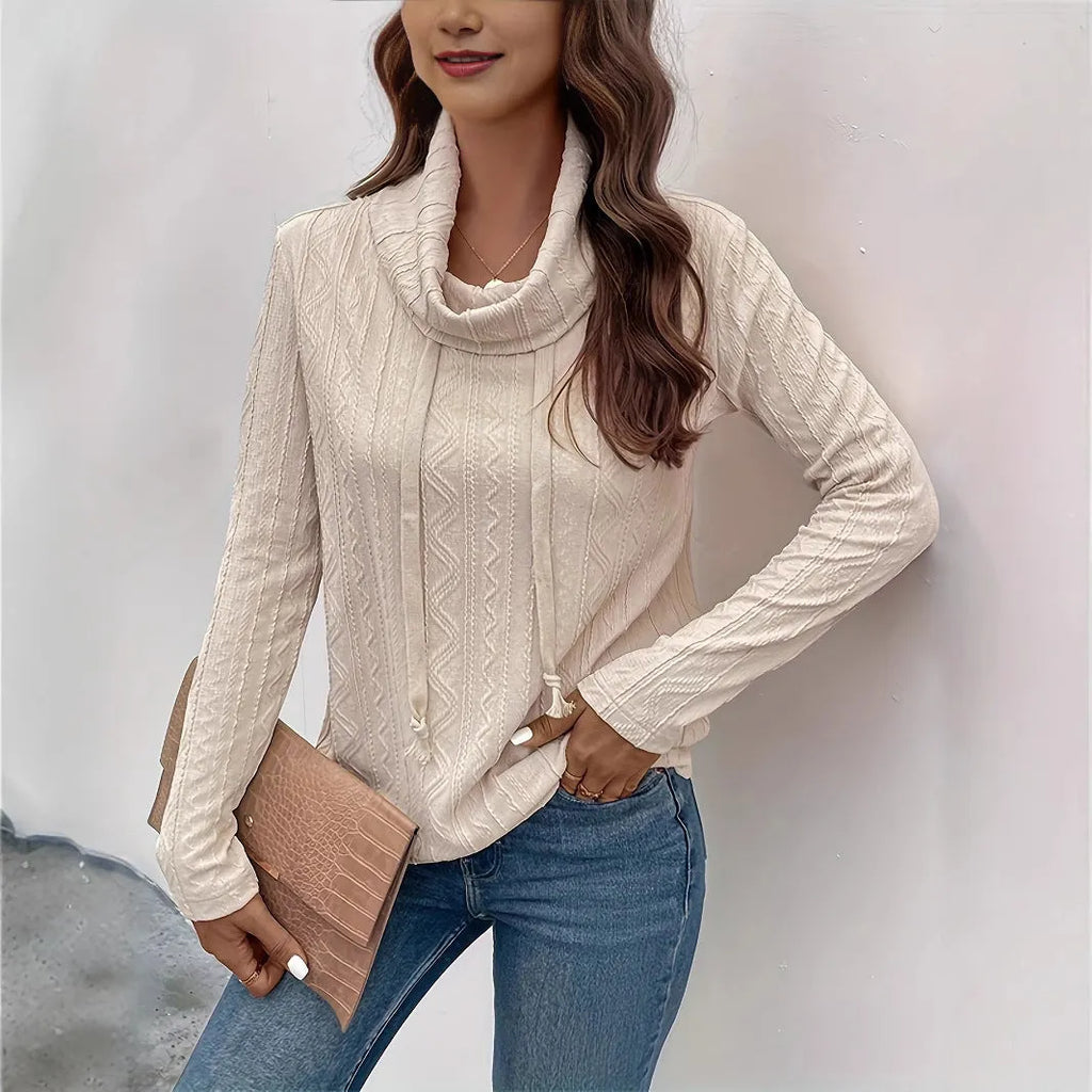 Apricot coloured long sleeve hooded pullover sweater with drawstring on mannequin