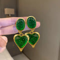 Silver needle pleated oval love heart stud earrings in purple, red, green, and yellow and white colours.