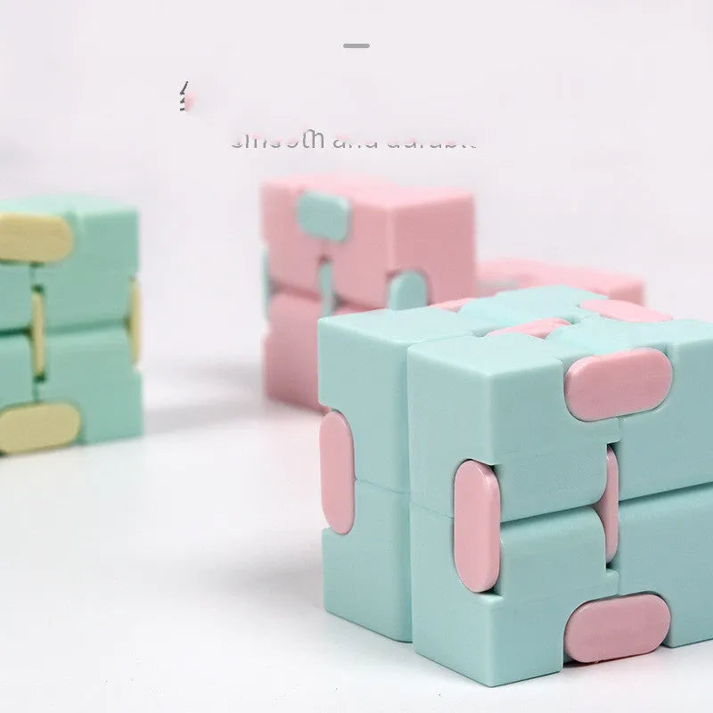 Infinity cube fidget puzzle toy in random colour, showing eight cubes that rotate freely in any direction