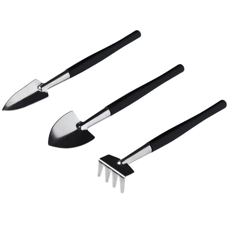 Black succulent gardening tools set with 17 pieces including scissors, tweezers, shovel, watering bottle, and cushion