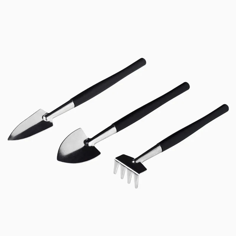 Black succulent gardening tools set with 17 pieces including scissors, tweezers, shovel, watering bottle, and cushion