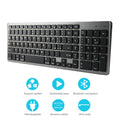 Ultra-thin white Bluetooth keyboard next to a tablet, showing its 104-key layout and slim profile.