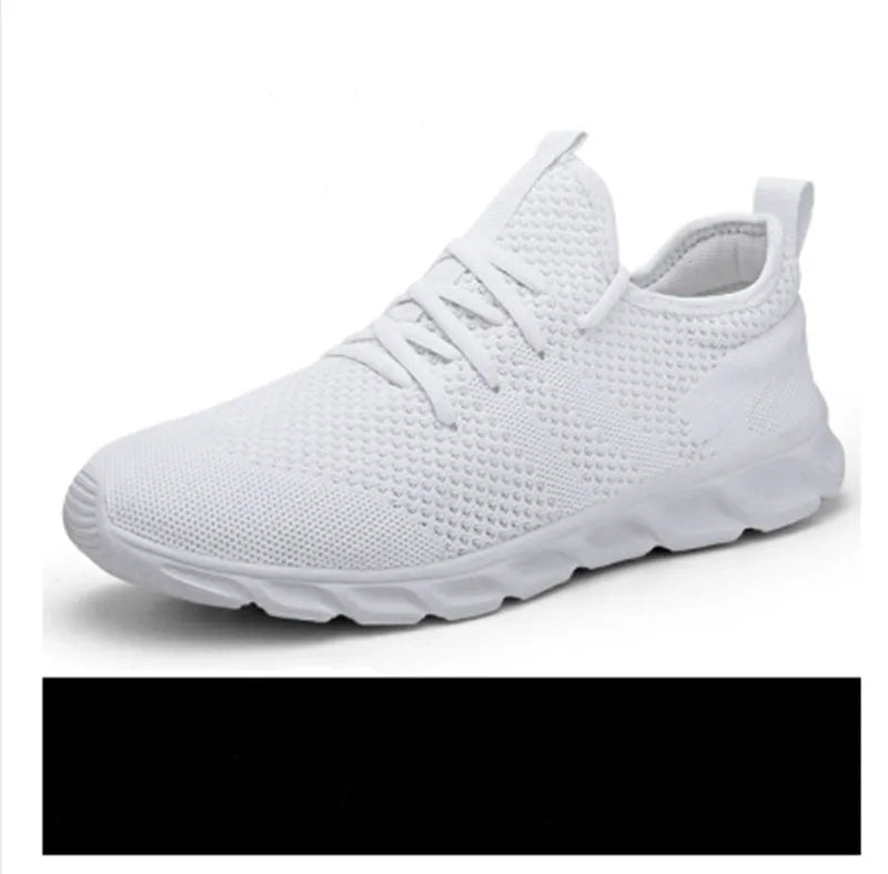Men's black and white mesh sneakers with lace-up front and PVC sole on a plain background