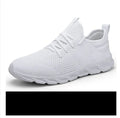 Men's black and white mesh sneakers with lace-up front and PVC sole on a plain background