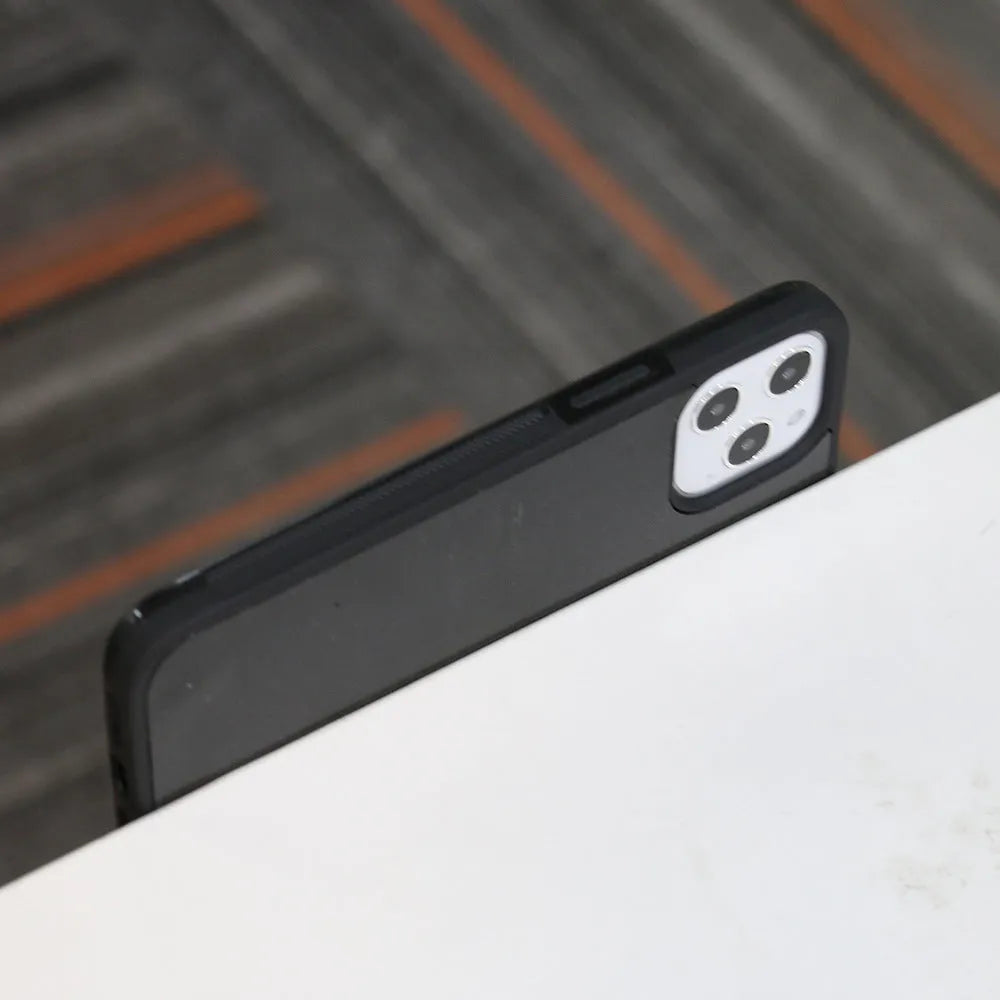 iPhone 12 anti-gravity TPU phone case in black or white, back cover with solid colour finish.