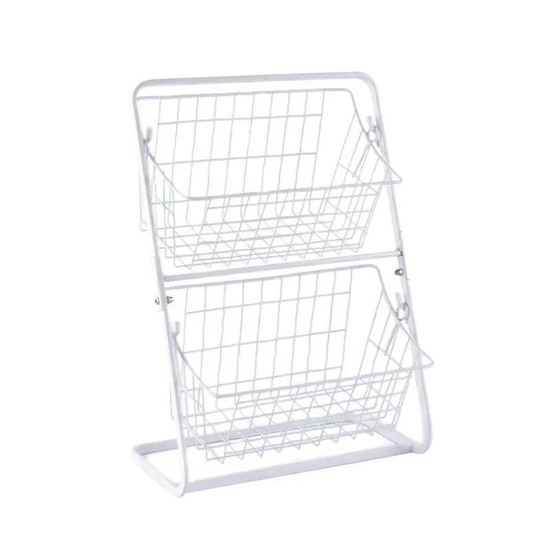 Black two-tier stainless steel kitchen storage rack with fruit and vegetables on countertop
