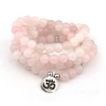 Natural stone powder crystal yoga bracelet with silver Buddha charm lotus pendant on neutral background