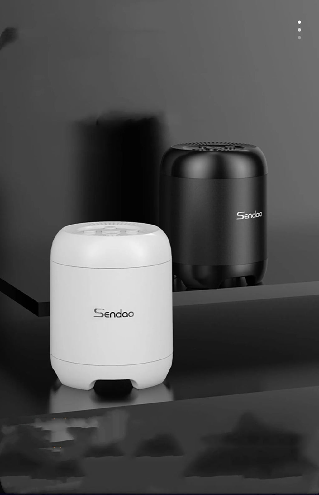 Small black or white portable Bluetooth speaker with card reader slot showing 90x73x73mm dimensions