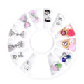 Wheel of 3D alloy nail charms with rhinestones in gold, transparent and colour, including bow, flower and perfume bottle shapes