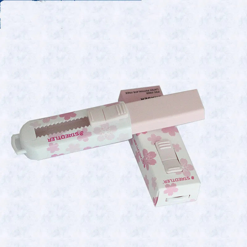 Pink square push-pull whiteboard eraser for students with replaceable core.