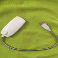 Flexible USB LED reading lamp with clip attached to book