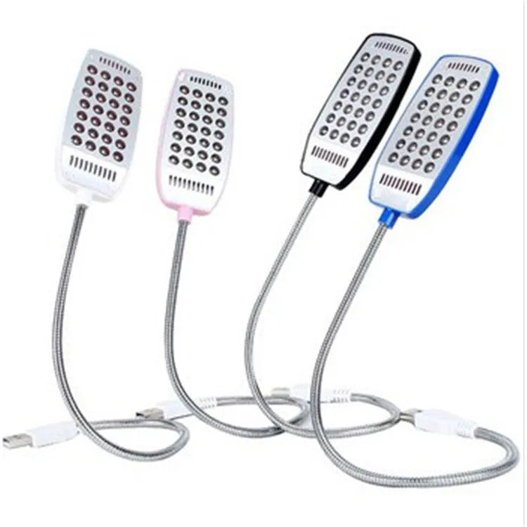 Flexible USB LED reading lamp with clip attached to book