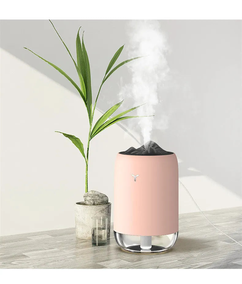Magic Flame ultrasonic humidifier and aroma diffuser in white, light blue or pink column design.
