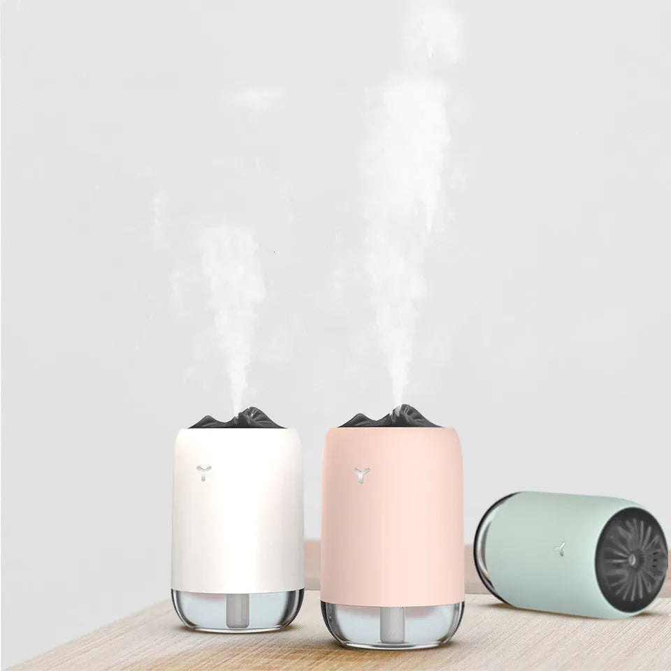 Magic Flame ultrasonic humidifier and aroma diffuser in white, light blue or pink column design.