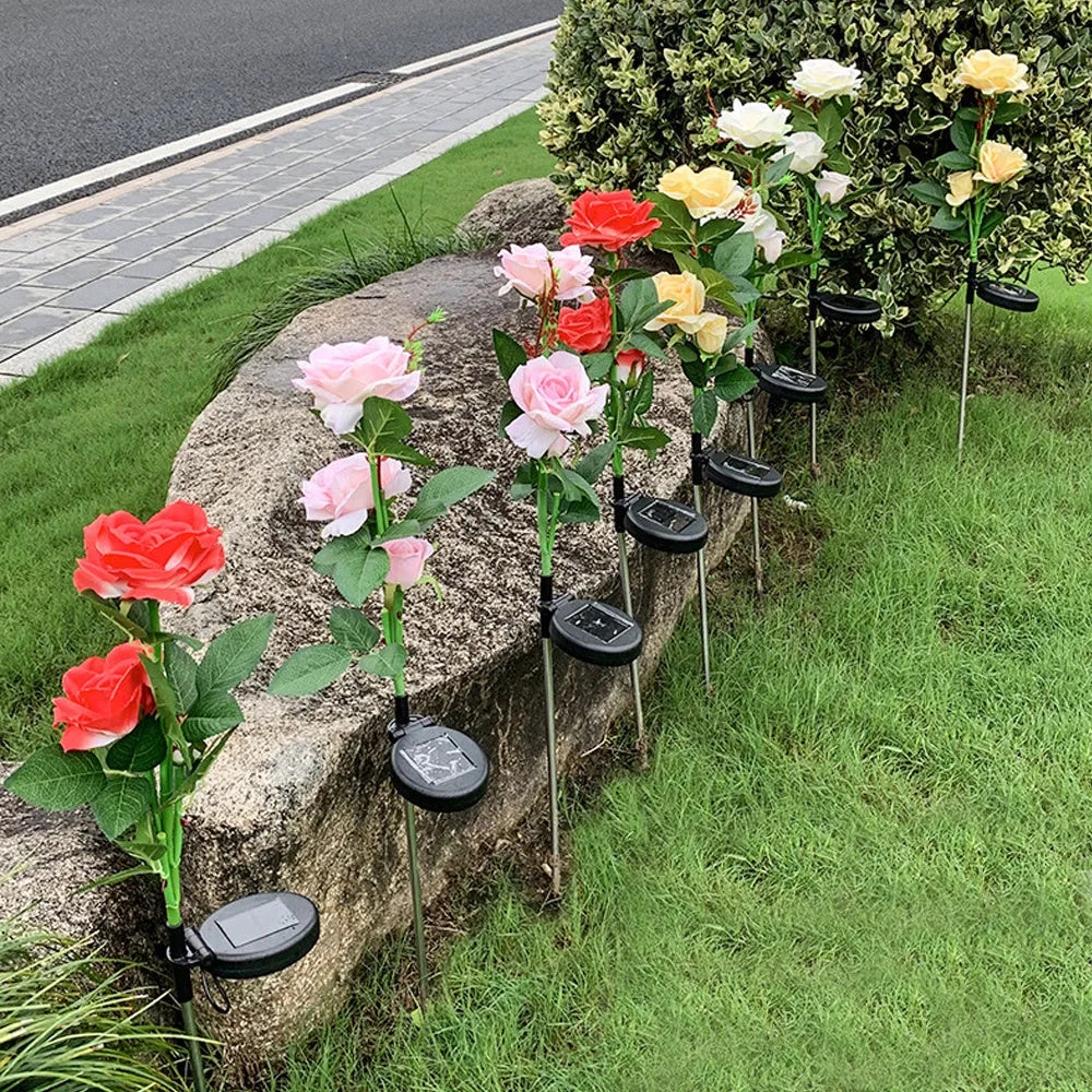 Outdoor solar rose garden lamp with three white LED light heads on stainless steel stem