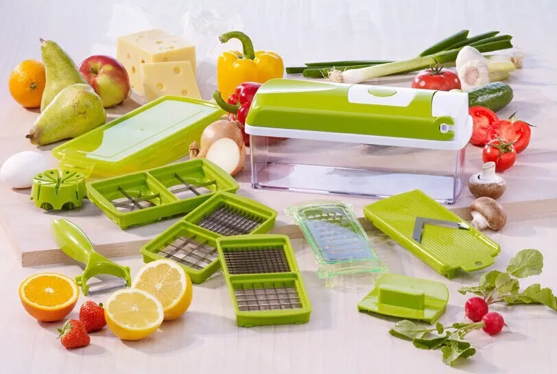 Green 12-piece manual vegetable chopper and food dicer set with stainless steel blades on a kitchen counter.