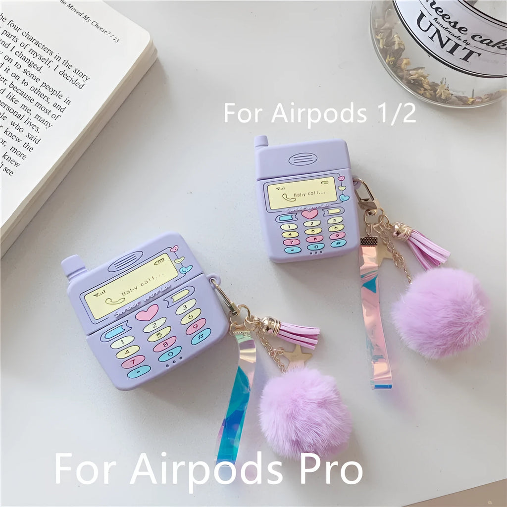 Purple silicone AirPods protective case with clamshell design and attached fur ball pendant