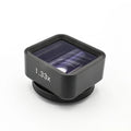 Black Sanyk 1.33x anamorphic widecreen lens for mobile phones on a dark background.
