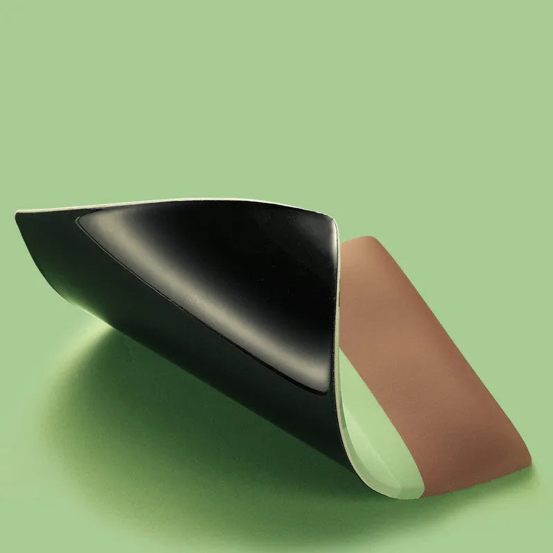Cute green Kiwi character design on a grey mouse pad with thick wrist support.