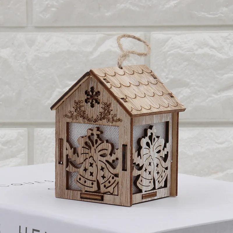 Three wooden Christmas house decorations including log bell, old man house, and snowman house in natural wood colour
