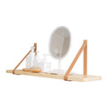 Pine wood wall-mounted shelf in Nordic style for storing remotes, books, and cosmetics.