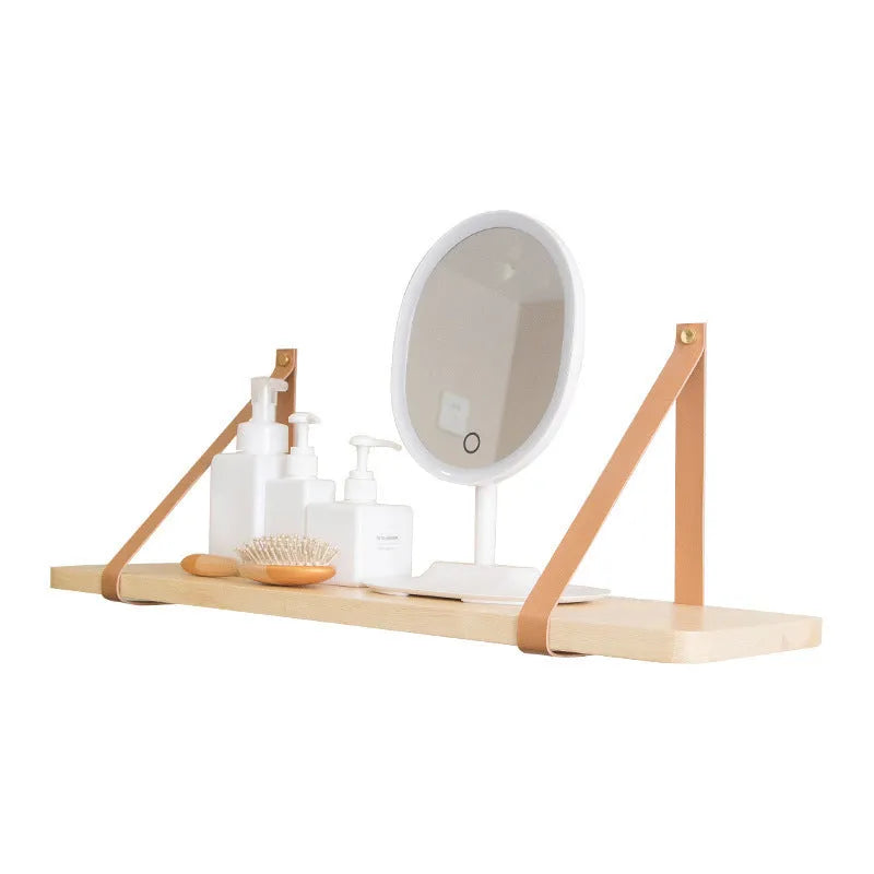 Pine wood wall-mounted shelf in Nordic style for storing remotes, books, and cosmetics.