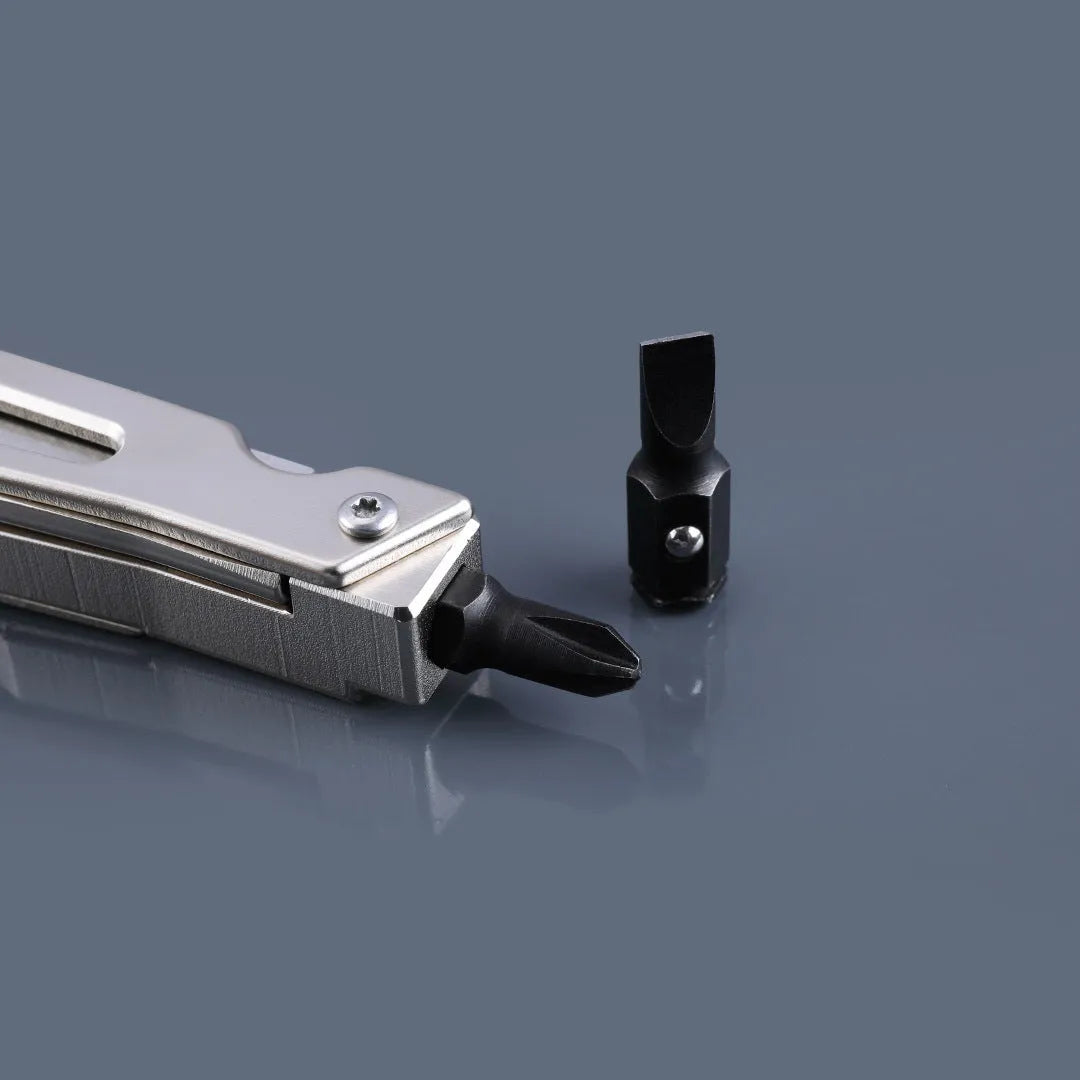 Stainless steel multi-function tool with wrench, knife blade, and needle nose pliers heads.