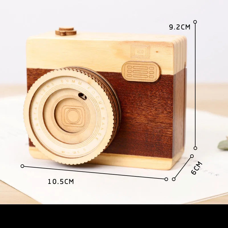 Wooden music box with rotating camera mechanism in pine wood construction