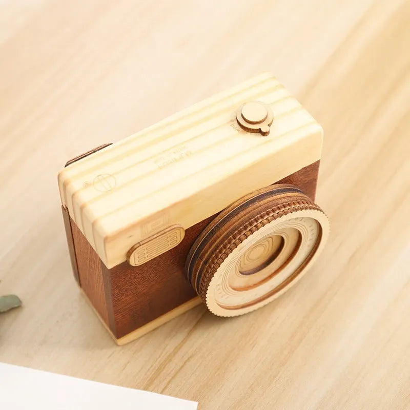 Wooden music box with rotating camera mechanism in pine wood construction