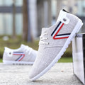 Men's soft-soled round toe canvas shoes in blue with colour stitching and totem pattern