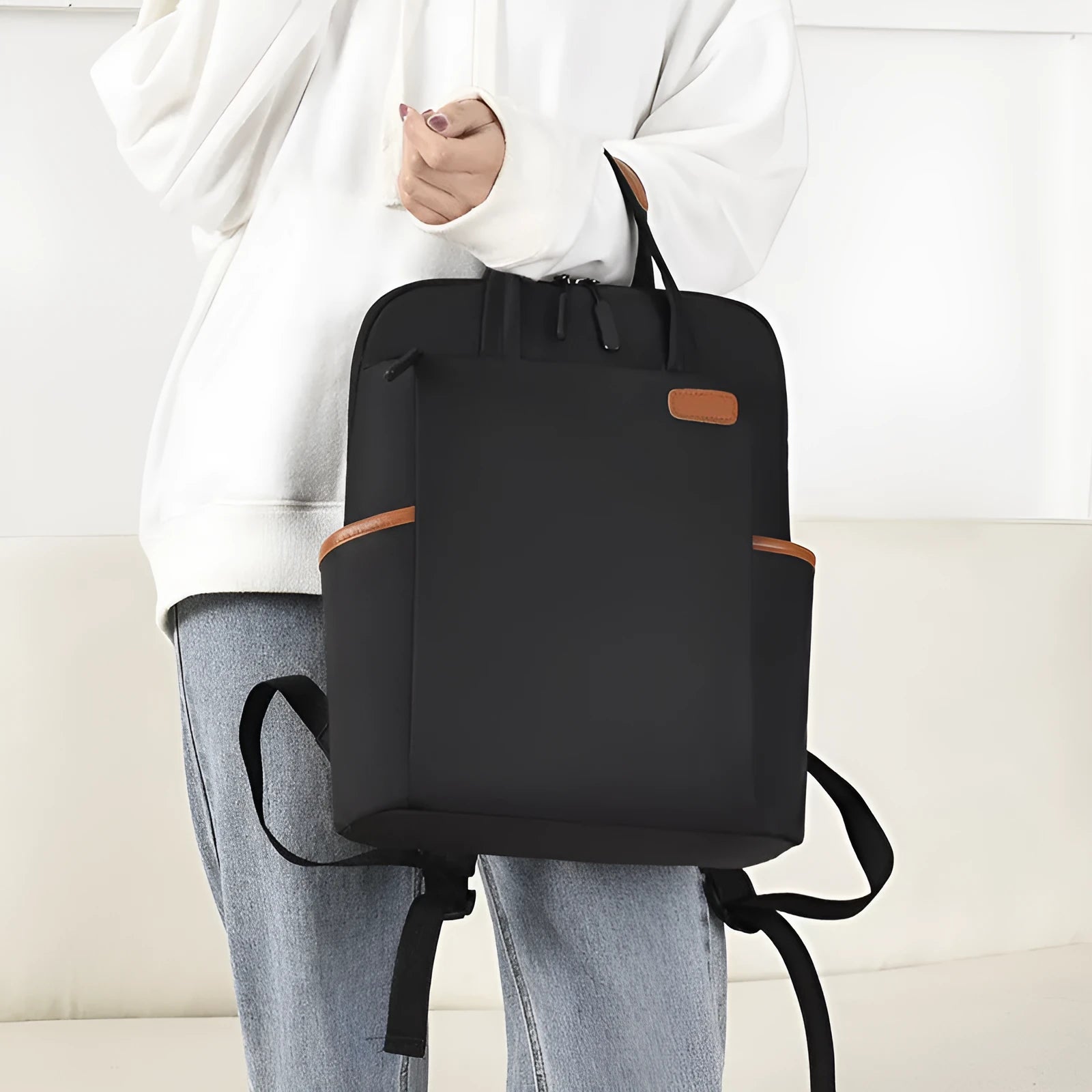 15.6-inch canvas computer backpack in black with waterproof finish and multiple internal compartments
